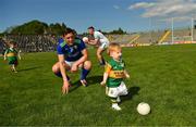 28 May 2022; David Moran with his son Eli and Paul Geaney with his son Paidi play on the pitch after the Munster GAA Football Senior Championship Final match between Kerry and Limerick at Fitzgerald Stadium in Killarney. Photo by Diarmuid Greene/Sportsfile