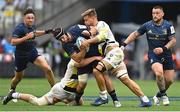 28 May 2022; Caelan Doris of Leinster is tackled by Pierre Bourgarit, left, and Wiaan Liebenberg of La Rochelle during the Heineken Champions Cup Final match between Leinster and La Rochelle at Stade Velodrome in Marseille, France. Photo by Ramsey Cardy/Sportsfile