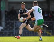28 May 2022; Alan Reilly of Sligo races past Eoin Walsh of London on his way to score his side's first goal during the Tailteann Cup Round 1 match between Sligo and London at Markievicz Park in Sligo. Photo by Ray McManus/Sportsfile