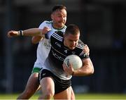 28 May 2022; Paul McNamara of Sligo is tackled by Eoin Walsh of London during the Tailteann Cup Round 1 match between Sligo and London at Markievicz Park in Sligo. Photo by Ray McManus/Sportsfile