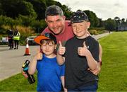 29 May 2022; parkrun Ireland in partnership with Vhi, added a new junior parkrun at Killarney House on May 29th. Junior parkruns take place over a 2km course weekly, and are a free and friendly event for 4 – 14 year olds, providing a fun and safe environment to enjoy exercise. To register for a junior parkrun near you visit www.parkrun.ie. Pictured are Ronan O'Sullivan, aged 5, and Shane O'Sullivan, aged 9 with their dad Patrick O'Sullivan from Kilcummin, during the parkrun at Killarney House in Kerry. Photo by Diarmuid Greene/Sportsfile