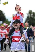 29 May 2022; Derry supporters Sean Cassidy, with his 5 year old daughter Olivia, from Faughanvale, before the Ulster GAA Football Senior Championship Final between Derry and Donegal at St Tiernach's Park in Clones, Monaghan. Photo by Ramsey Cardy/Sportsfile