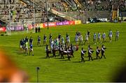 28 May 2022; Limerick and Kerry players walk behind the Millstreet Pipe Band before the Munster GAA Football Senior Championship Final match between Kerry and Limerick at Fitzgerald Stadium in Killarney. Photo by Diarmuid Greene/Sportsfile