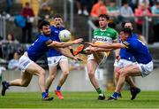 29 May 2022; Jordan Hayes of Offaly in action against Malachy Stone, left, and Pádraig O'Toole of Wicklow during the Tailteann Cup Round 1 match between Offaly and Wicklow at O'Connor Park in Tullamore, Offaly. Photo by Harry Murphy/Sportsfile