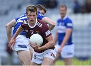 29 May 2022; John Heslin of Westmeath gets past Kevin Swayne of Laois during the Tailteann Cup Round 1 match between Laois and Westmeath at MW Hire O'Moore Park in Portlaoise, Laois. Photo by Piaras Ó Mídheach/Sportsfile