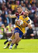 29 May 2022; Donie Smith of Roscommon is tackled by Damien Comer of Galway during the Connacht GAA Football Senior Championship Final match between Galway and Roscommon at Pearse Stadium in Galway. Photo by Eóin Noonan/Sportsfile
