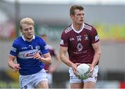 29 May 2022; John Heslin of Westmeath in action against Seán Greene of Laois during the Tailteann Cup Round 1 match between Laois and Westmeath at MW Hire O'Moore Park in Portlaoise, Laois. Photo by Piaras Ó Mídheach/Sportsfile