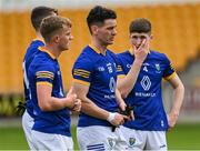29 May 2022; Wicklow players including Diarmuid Egan, 18, and Niall Darby, 4, react after their side's defeat in the Tailteann Cup Round 1 match between Offaly and Wicklow at O'Connor Park in Tullamore, Offaly. Photo by Harry Murphy/Sportsfile