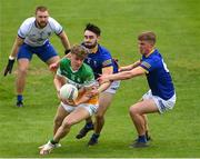 29 May 2022; Jack Bryant of Offaly is tackled by Malachy Stone , left, and Zach Cullen of Wicklow during the Tailteann Cup Round 1 match between Offaly and Wicklow at O'Connor Park in Tullamore, Offaly. Photo by Harry Murphy/Sportsfile