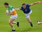 29 May 2022; Niall McNamee of Offaly is tackled by Rory Stokes of Wicklow during the Tailteann Cup Round 1 match between Offaly and Wicklow at O'Connor Park in Tullamore, Offaly. Photo by Harry Murphy/Sportsfile