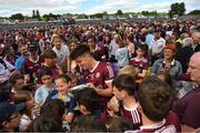 29 May 2022; Seán Kelly of Galway takes photos with supporters and the cup after the Connacht GAA Football Senior Championship Final match between Galway and Roscommon at Pearse Stadium in Galway. Photo by Eóin Noonan/Sportsfile