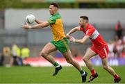 29 May 2022; Jason McGee of Donegal in action against Niall Loughlin of Derry during the Ulster GAA Football Senior Championship Final between Derry and Donegal at St Tiernach's Park in Clones, Monaghan. Photo by Stephen McCarthy/Sportsfile