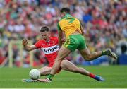 29 May 2022; Shane McGuigan of Derry is tackled by Odhran McFadden Ferry of Donegal during the Ulster GAA Football Senior Championship Final between Derry and Donegal at St Tiernach's Park in Clones, Monaghan. Photo by Ramsey Cardy/Sportsfile