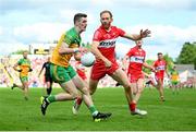29 May 2022; Caolan Ward of Donegal in action against Conor Glass of Derry during the Ulster GAA Football Senior Championship Final between Derry and Donegal at St Tiernach's Park in Clones, Monaghan. Photo by Stephen McCarthy/Sportsfile