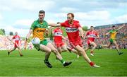 29 May 2022; Caolan Ward of Donegal in action against Conor Glass of Derry during the Ulster GAA Football Senior Championship Final between Derry and Donegal at St Tiernach's Park in Clones, Monaghan. Photo by Stephen McCarthy/Sportsfile