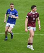 29 May 2022; Ross Munnelly of Laois celebrates a score by teammate Eoin Lowry, not pictured, as Nigel Harte of Westmeath looks on, during the Tailteann Cup Round 1 match between Laois and Westmeath at MW Hire O'Moore Park in Portlaoise, Laois. Photo by Piaras Ó Mídheach/Sportsfile