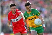 29 May 2022; Peadar Mogan of Donegal in action against Conor Doherty of Derry during the Ulster GAA Football Senior Championship Final between Derry and Donegal at St Tiernach's Park in Clones, Monaghan. Photo by Ramsey Cardy/Sportsfile