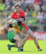 29 May 2022; Ryan McHugh of Donegal is tackled by Brendan Rogers of Derry during the Ulster GAA Football Senior Championship Final between Derry and Donegal at St Tiernach's Park in Clones, Monaghan. Photo by Ramsey Cardy/Sportsfile