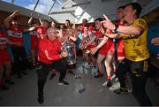 29 May 2022; Derry kitman Colin McGuigan and Derry players celebrate with the trophy after the Ulster GAA Football Senior Championship Final between Derry and Donegal at St Tiernach's Park in Clones, Monaghan. Photo by Ramsey Cardy/Sportsfile