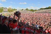 29 May 2022; Derry captain Christopher McKaigue lifts the trophy after his side's victory in the Ulster GAA Football Senior Championship Final between Derry and Donegal at St Tiernach's Park in Clones, Monaghan. Photo by Ramsey Cardy/Sportsfile
