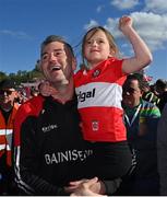 29 May 2022; Derry manager Rory Gallagher celebrates with his daughter Allie, aged 6, after the Ulster GAA Football Senior Championship Final between Derry and Donegal at St Tiernach's Park in Clones, Monaghan. Photo by Ramsey Cardy/Sportsfile