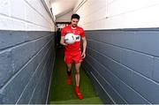 29 May 2022; Derry captain Christopher McKaigue returns to the dressing room with the match ball after the Ulster GAA Football Senior Championship Final between Derry and Donegal at St Tiernach's Park in Clones, Monaghan. Photo by Ramsey Cardy/Sportsfile
