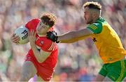 29 May 2022; Lachlan Murray of Derry is tackled by Stephen McMenamin of Donegal during the Ulster GAA Football Senior Championship Final between Derry and Donegal at St Tiernach's Park in Clones, Monaghan. Photo by Ramsey Cardy/Sportsfile