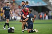 28 May 2022; Jamison Gibson-Park of Leinster is treated by Leinster head of medical Professor John Ryan during the Heineken Champions Cup Final match between Leinster and La Rochelle at Stade Velodrome in Marseille, France. Photo by Ramsey Cardy/Sportsfile