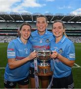 28 May 2022; Dublin players, from left, Jessica Tobin, Jennifer Dunne and Martha Byrne celebrate with the Mary Ramsbottom Cup after the Leinster LGFA Senior Football Championship Final match between Meath and Dublin at Croke Park in Dublin. Photo by Stephen McCarthy/Sportsfile