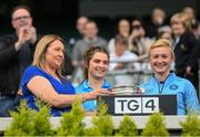 28 May 2022; Niamh Collins and Carla Rowe of Dublin are presented with the cup by Leinster LGFA President Trina Murray during the Leinster LGFA Senior Football Championship Final match beween Meath and Dublin at Croke Park in Dublin. Photo by Stephen McCarthy/Sportsfile