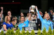 28 May 2022; Niamh Collins and Carla Rowe of Dublin lift the cup alongside Leinster LGFA President Trina Murray, left, during the Leinster LGFA Senior Football Championship Final match beween Meath and Dublin at Croke Park in Dublin. Photo by Stephen McCarthy/Sportsfile