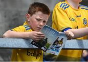 29 May 2022; A young Roscommon supporter studies the programme before the Connacht GAA Football Senior Championship Final match between Galway and Roscommon at Pearse Stadium in Galway. Photo by Sam Barnes/Sportsfile