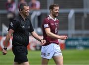 29 May 2022; Westmeath captain Kevin Maguire with linesman Patrick Maguire before the Tailteann Cup Round 1 match between Laois and Westmeath at MW Hire O'Moore Park in Portlaoise, Laois. Photo by Piaras Ó Mídheach/Sportsfile