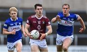 29 May 2022; Sam McCartan of Westmeath in action against Seán Greene, left, and Donal Kingston of Laois during the Tailteann Cup Round 1 match between Laois and Westmeath at MW Hire O'Moore Park in Portlaoise, Laois. Photo by Piaras Ó Mídheach/Sportsfile