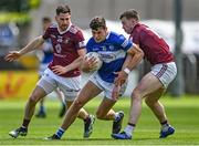 29 May 2022; Mark Barry of Laois in action against James Dolan, left, and Ger Egan of Westmeath during the Tailteann Cup Round 1 match between Laois and Westmeath at MW Hire O'Moore Park in Portlaoise, Laois. Photo by Piaras Ó Mídheach/Sportsfile