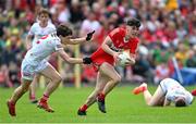 29 May 2022; Eoin Higgins of Derry in action against Joey Clarke of Tyrone during the Electric Ireland Ulster GAA Football Minor Championship Final match between Derry and Tyrone at St Tiernach's Park in Clones, Monaghan. Photo by Ramsey Cardy/Sportsfile