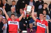 29 May 2022; Conor Doherty, left, and Shane McGuigan of Derry lift the Anglo Celt Cup after the Ulster GAA Football Senior Championship Final between Derry and Donegal at St Tiernach's Park in Clones, Monaghan. Photo by Stephen McCarthy/Sportsfile