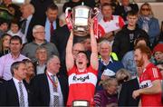 29 May 2022; Gareth McKinless of Derry lifts the Anglo Celt Cup after the Ulster GAA Football Senior Championship Final between Derry and Donegal at St Tiernach's Park in Clones, Monaghan. Photo by Stephen McCarthy/Sportsfile