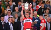 29 May 2022; Emmett Bradley of Derry lifts the Anglo Celt Cup after the Ulster GAA Football Senior Championship Final between Derry and Donegal at St Tiernach's Park in Clones, Monaghan. Photo by Stephen McCarthy/Sportsfile