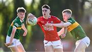 1 June 2022; Colm Geary of Cork in action against Niall Collins, left, and Tomás Ashe of Kerry during the Electric Ireland Munster GAA Minor Football Championship Final match between Kerry and Cork at Páirc Uí Rinn in Cork. Photo by Piaras Ó Mídheach/Sportsfile