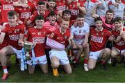 1 June 2022; Brian Hayes of Cork holds the cup as he celebrates with his teammates after their victory in the Electric Ireland Munster GAA Minor Football Championship Final match between Kerry and Cork at Páirc Uí Rinn in Cork. Photo by Piaras Ó Mídheach/Sportsfile