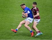 29 May 2022; Eoin Lowry of Laois in action against Jack Smith of Westmeath during the Tailteann Cup Round 1 match between Laois and Westmeath at MW Hire O'Moore Park in Portlaoise, Laois. Photo by Piaras Ó Mídheach/Sportsfile