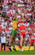 29 May 2022; Conor Glass of Derry in action against Jason McGee of Donegal during the Ulster GAA Football Senior Championship Final between Derry and Donegal at St Tiernach's Park in Clones, Monaghan. Photo by Stephen McCarthy/Sportsfile
