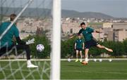 2 June 2022; Troy Parrott has a shot on goal saved by goalkeeper Caoimhin Kelleher during a Republic of Ireland training session at the Yerevan Football Academy in Yerevan, Armenia. Photo by Stephen McCarthy/Sportsfile