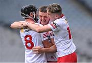 21 May 2022; Tyrone players, from left, Bryan McGurk, Lorcan Devlin and Ruairí Slane celebrate after their side's victory in the Nickey Rackard Cup Final match between Roscommon and Tyrone at Croke Park in Dublin. Photo by Piaras Ó Mídheach/Sportsfile