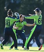3 June 2022; Arlene Kelly of Ireland, centre, celebrates with team-mates Mary Waldron, left, and Gaby Lewis after catching and bowling Tazmin Brits of South Africa during the Women's T20 International match between Ireland and South Africa at Pembroke Cricket Club in Dublin. Photo by Sam Barnes/Sportsfile