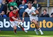 3 June 2022; Stewart Moore of Ulster runs in to score his side's second try despite the attempts of Andrew Conway of Munster during the United Rugby Championship Quarter-Final match between Ulster and Munster at Kingspan Stadium in Belfast. Photo by Ben McShane/Sportsfile