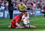 3 June 2022; Stewart Moore of Ulster scores his side's third try despite the tackle of Josh Wycherley of Munster during the United Rugby Championship Quarter-Final match between Ulster and Munster at Kingspan Stadium in Belfast. Photo by Ben McShane/Sportsfile