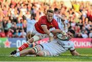 3 June 2022; Nick Timoney of Ulster dives over to score his side's fourth try despite the tackle of Mike Haley of Munster during the United Rugby Championship Quarter-Final match between Ulster and Munster at Kingspan Stadium in Belfast. Photo by Ramsey Cardy/Sportsfile