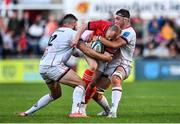 3 June 2022; Keith Earls of Munster is tackled by Marcus Rea, right, and Stuart McCloskey of Ulster during the United Rugby Championship Quarter-Final match between Ulster and Munster at Kingspan Stadium in Belfast. Photo by Ben McShane/Sportsfile